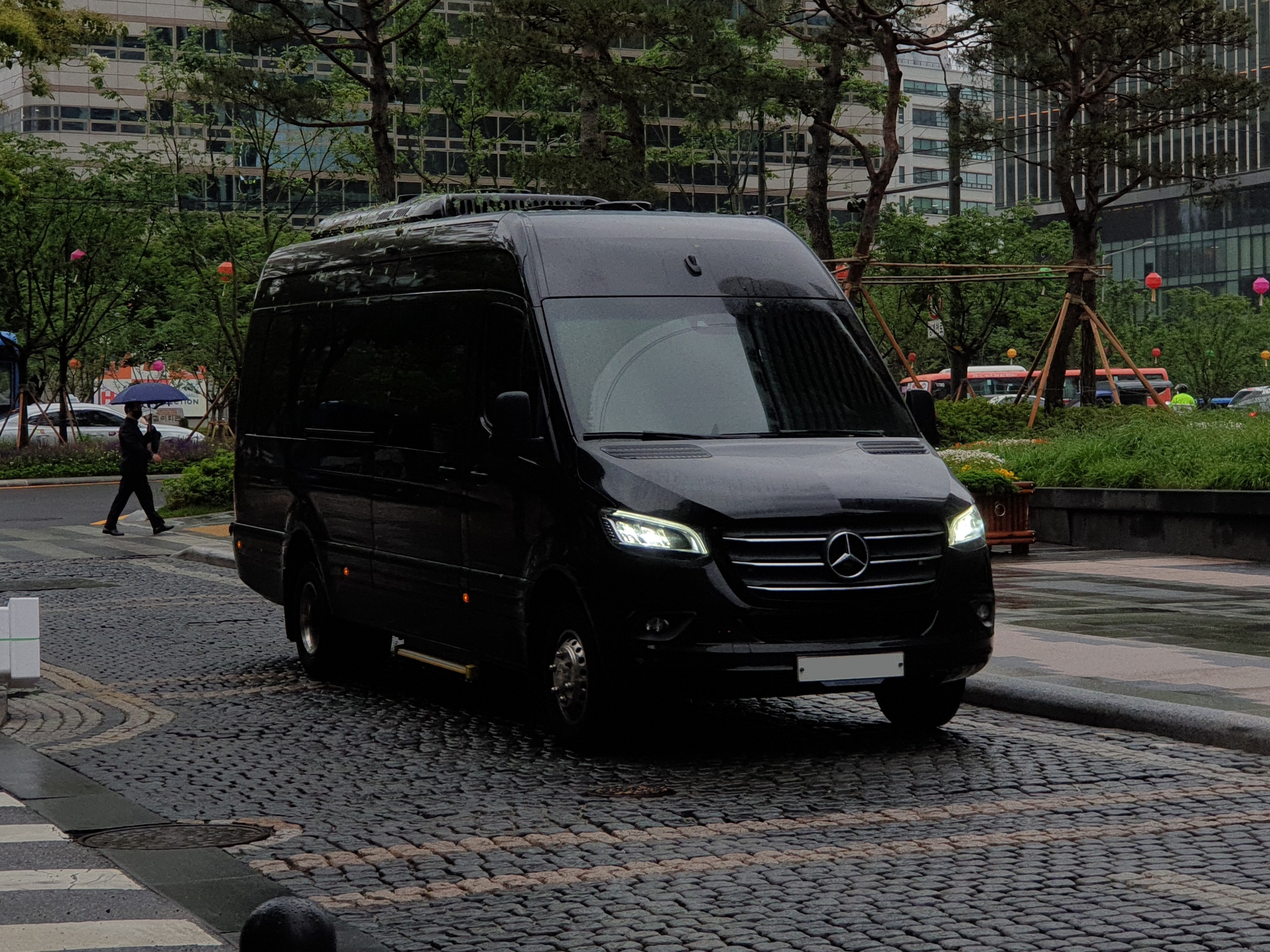 VIP transfer vehicle (black Mercedes minibus)